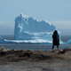 A resident views the first iceberg of the season as it passes the South Shore, also known as "Iceberg Alley", near Ferryland Newfoundland, Canada April 16, 2017.